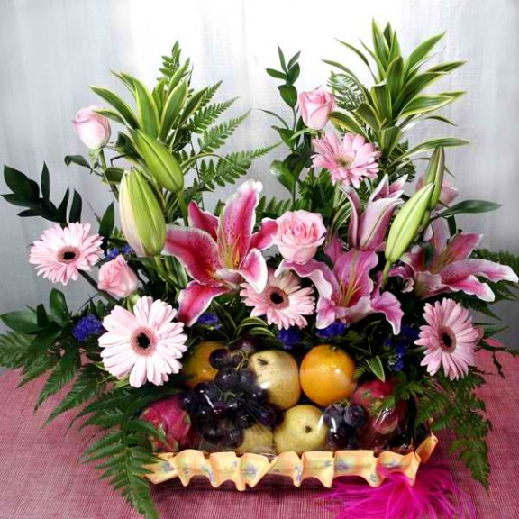 Pink Lily, Gerbera & Roses Fruits Basket Arrangement